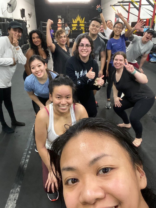 Members taking a group selfie after class