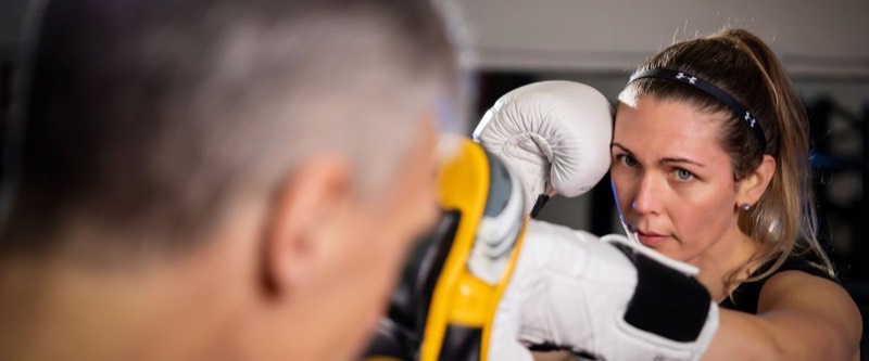 Woman training kickboxing with coach at Fight Fitness Markham